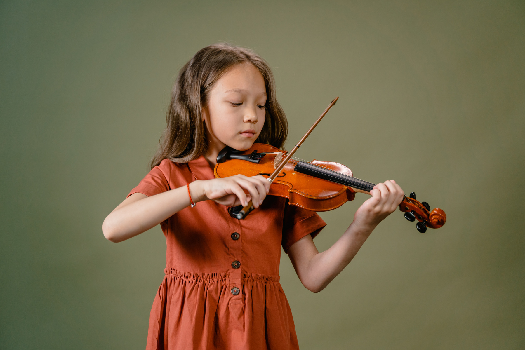 Girl in Brown Dress Playing Violin