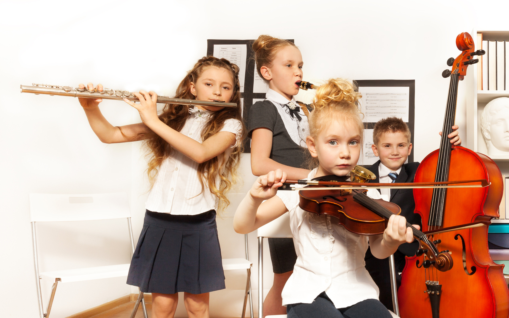 School Children Play Musical Instruments Together